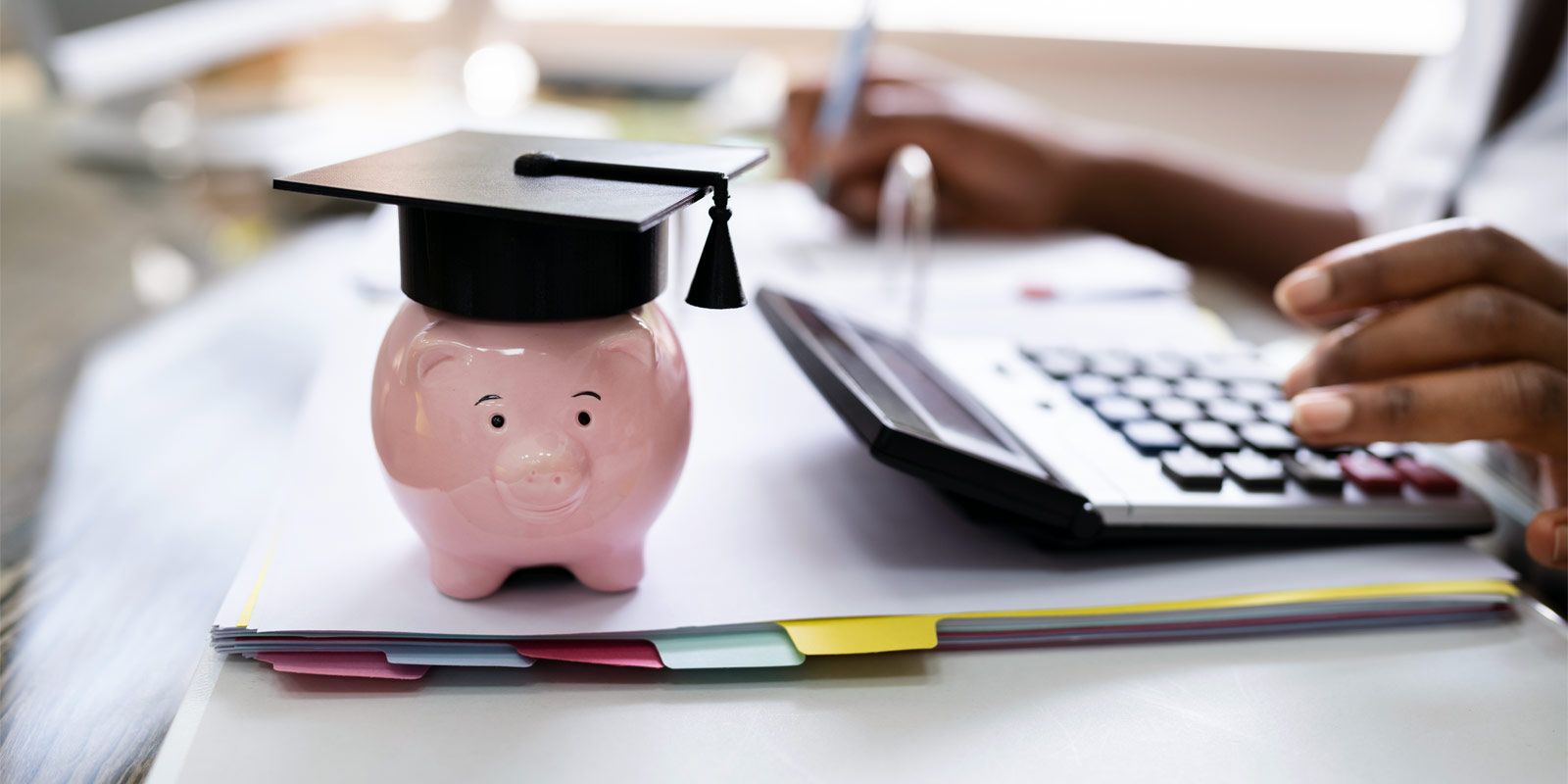 a life insurance consultant assisting a client with paying off their student loans