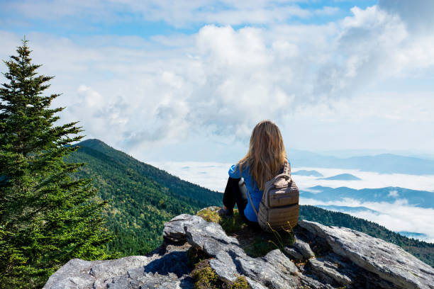 Woman Staring At A Beautiful Mountain Ridge In North Carolina