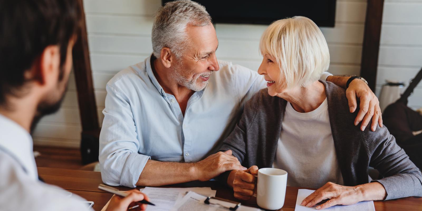 elderly couple meet with agent