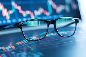 Eyeglasses Over Stock Market Chart Showing Investment Concept