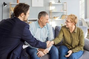 Insurance Expert Meeting with Senior Couple for Annuity Investment