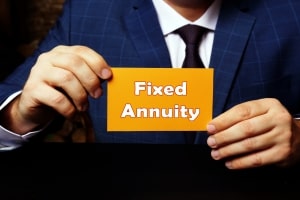 Man Holding A Card with Fixed Annuity Text