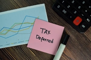 Tax Deferred Written on Sticky Notes with Marker