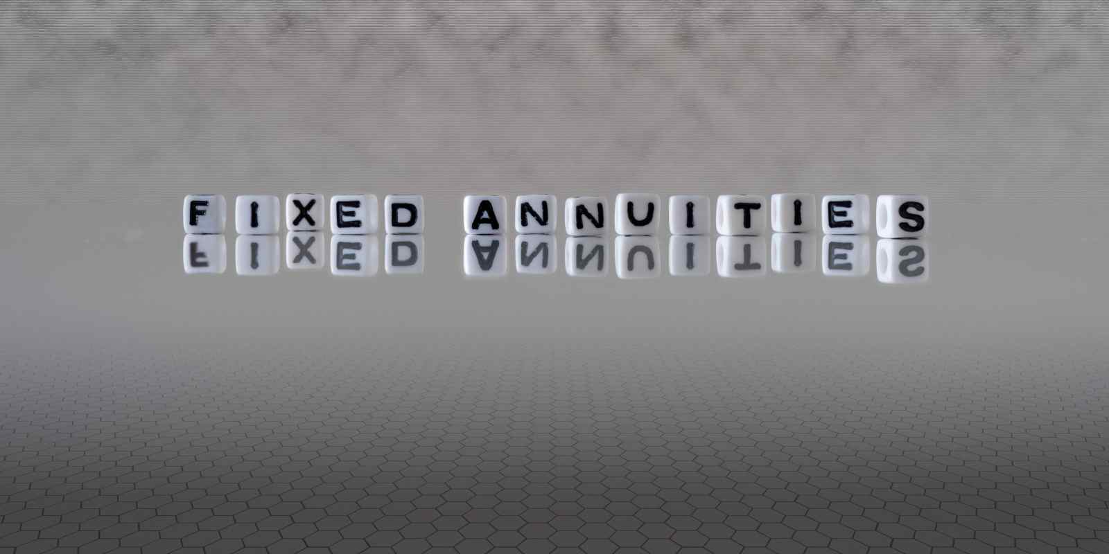Fixed Annuities Word Represented by Black and White Letter Cubes