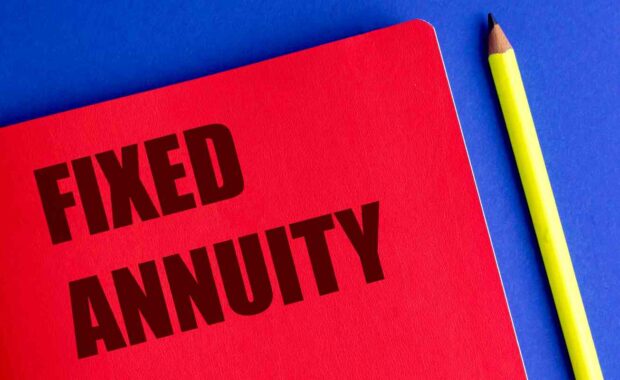 Red Notebook with Text Fixed Annuity and Yellow Pencil