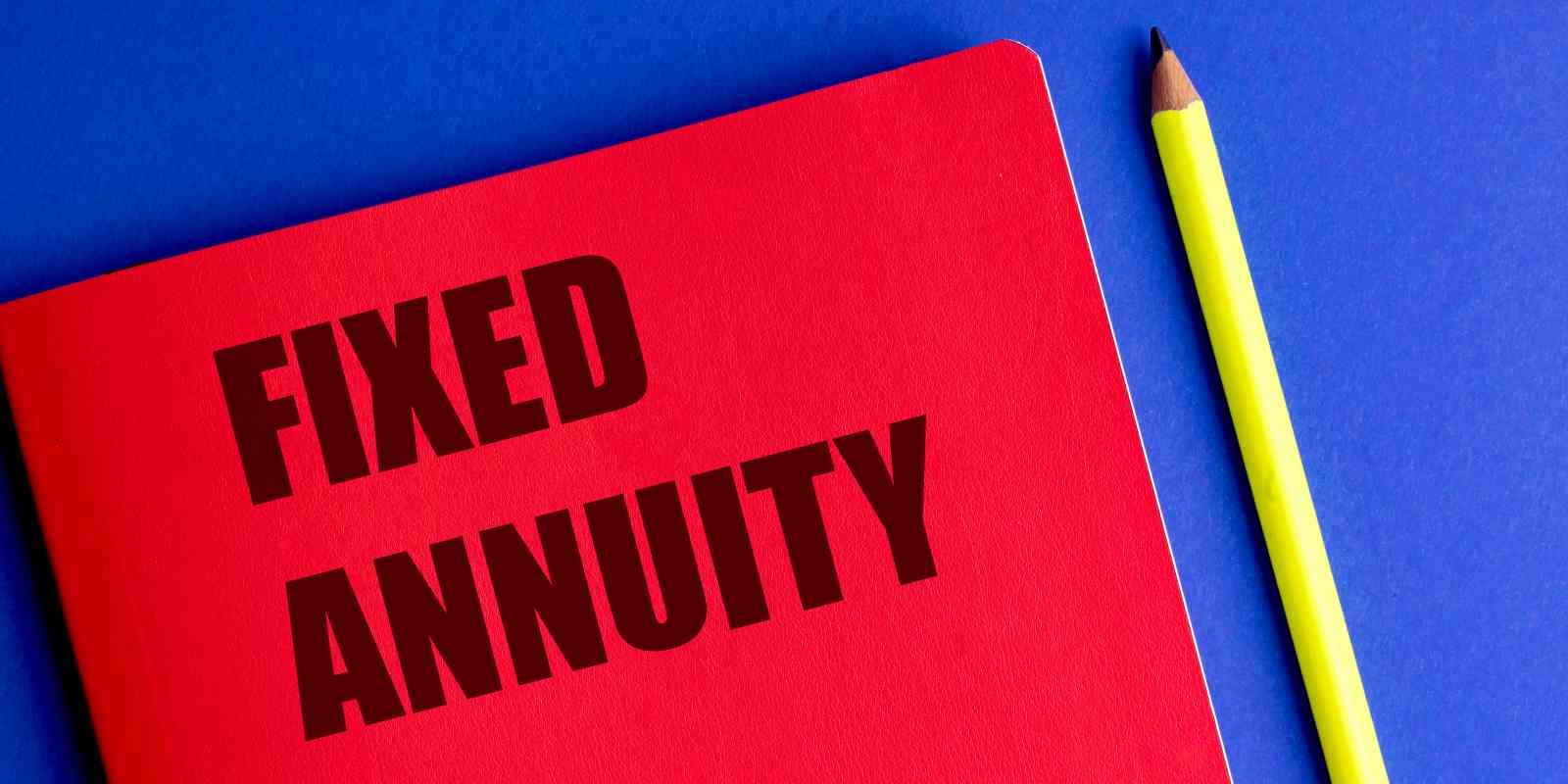Red Notebook with Text Fixed Annuity and Yellow Pencil